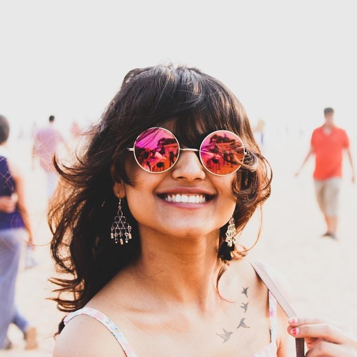 Alexandra Liu, Lead Design Curator at Willow Birch Moss, reviewing corporate floral arrangements